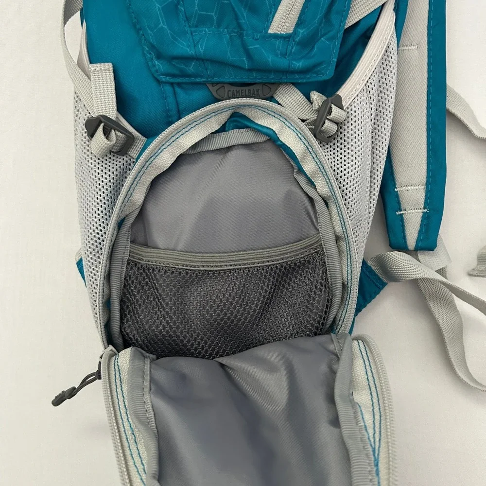 CamelBak Velocity Hydration Pack Teal Blue Reflective Hiking Running Bag 70oz